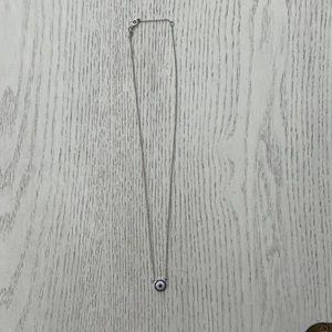 Silver necklace with blue and silver pendant